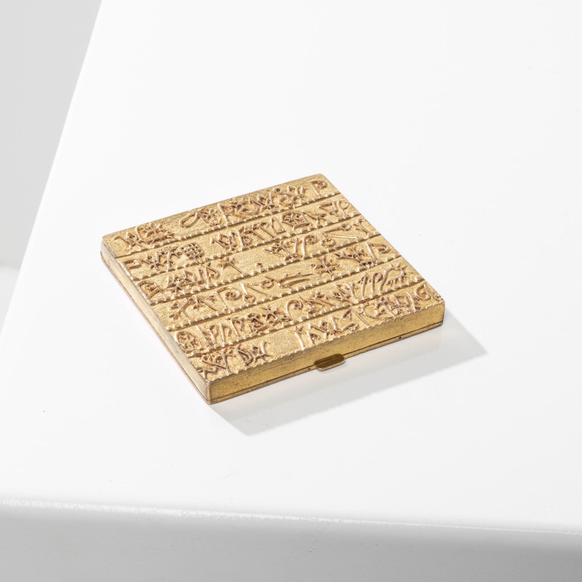 The Armenian alphabet powder compact in gilded bronze Line Vautrin