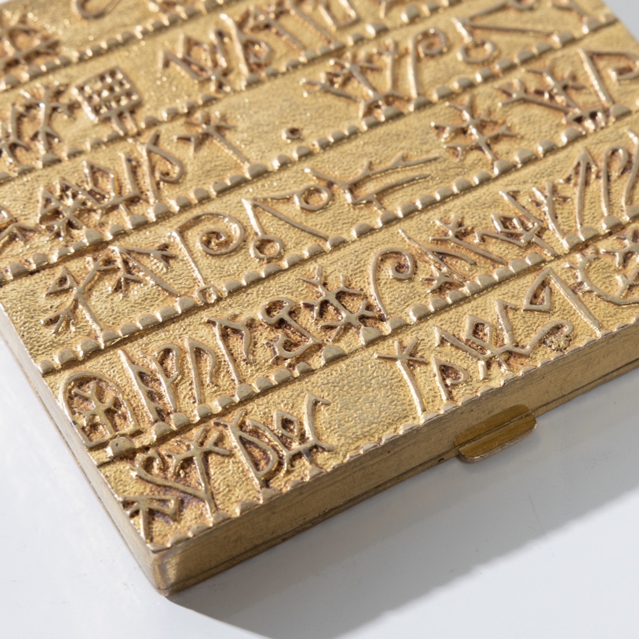 The Armenian alphabet powder compact in gilded bronze Line Vautrin